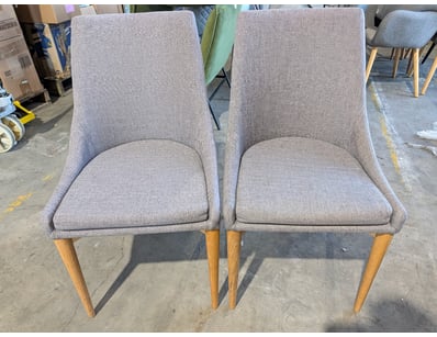 Pair of dining chairs featuring grey upholstered s...