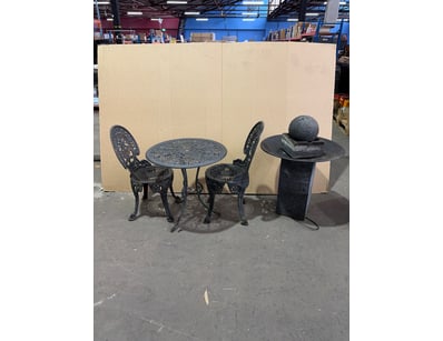 Cast iron garden furniture set comprising a bistro...