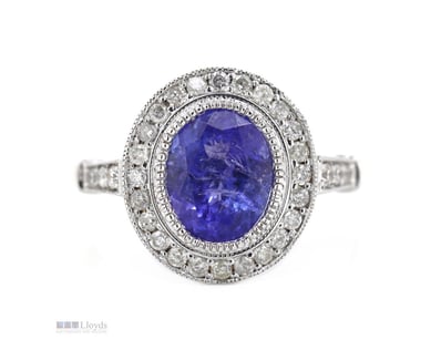 14K YELLOW GOLD, TANZANITE AND DIAMOND, HALO RING....