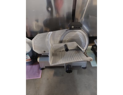 Brice brand commercial meat slicer featuring a mix...