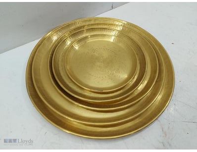 Nested set of brass plates with hammered finish an...