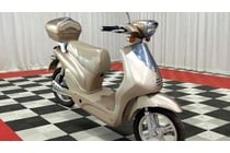Cream/beige electric scooter featuring retro