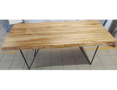 Dining table featuring a solid timber top construc...