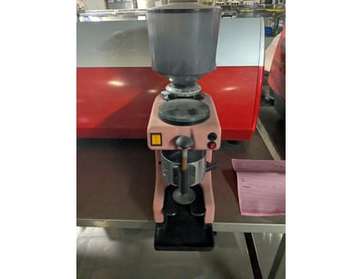Professional-grade pink burr coffee grinder featur...