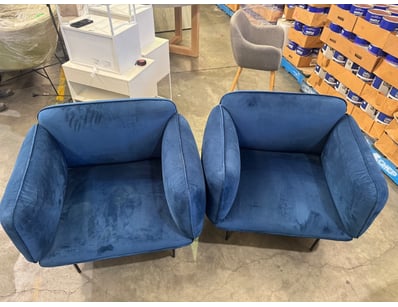 Pair of dark blue suede chairs 

Note: sold as pai...