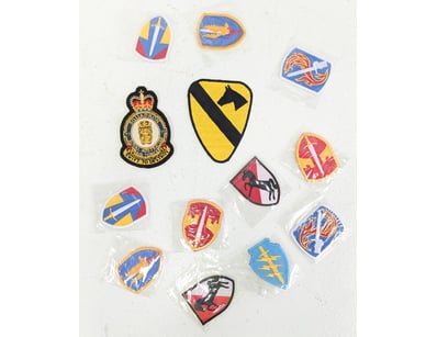 COLLECTION OF MILITARY UNIT PATCHES AND INSIGNIA

...