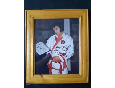 ELVIS PRESLEY ACCEPTING AN HONORARY 8TH-DEGREE BLA...