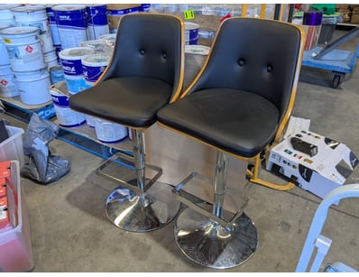 Pair of modern bar stools featuring black padded P...