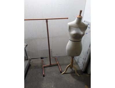 Copper pipe garment rack featuring industrial-styl...