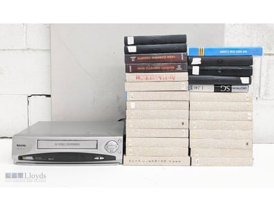 VINTAGE VHS TAPE COLLECTION WITH SANYO VCR PLAYER
...