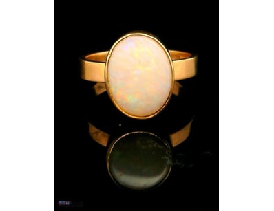 9CT YELLOW GOLD AND 3.5CT COOBER PEDY OPAL RING 

...