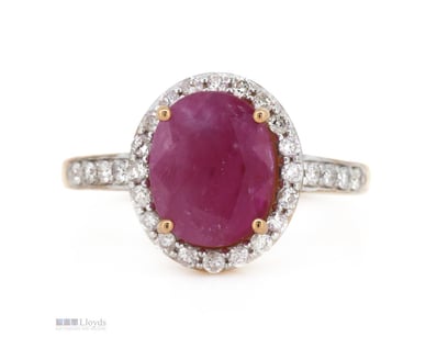 14K ROSE GOLD, RUBY AND DIAMOND, HALO RING.      
...