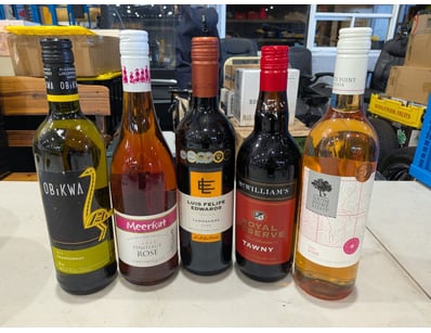 Collection of five premium wine bottles featuring ...