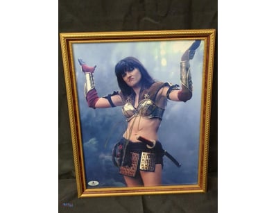 AUTOGRAPHED PHOTOGRAPH OF LUCY LAWLESS.

Item Size...
