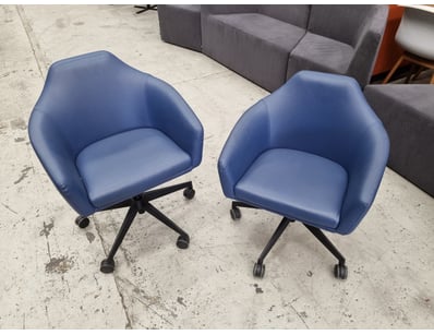 Pair of modern blue upholstered office chairs feat...