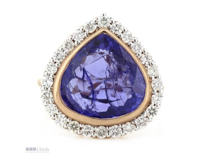 14K ROSE GOLD, TANZANITE AND DIAMOND, HALO RING.  ...
