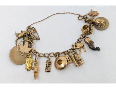 9k yellow gold chain charm bracelet, various charm...