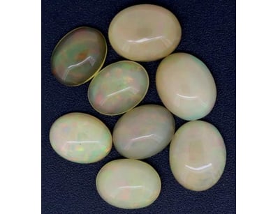 10.47CT TSW X 8 OPALS

Oval Cabochon Cut, Orange...
