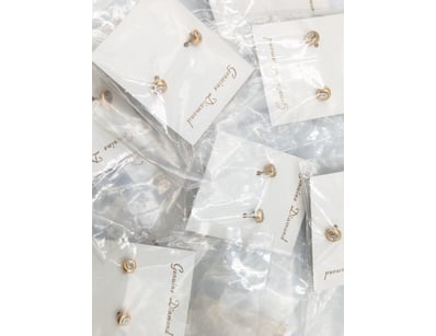 PAIR OF GENUINE DIAMOND STUD EARRINGS IN FAUX GOLD...