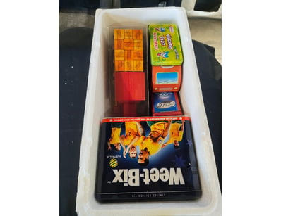 Comprehensive vintage collectible tins featuring n...