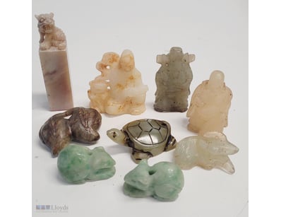 COLLECTION OF NINE ASIAN JADE AND STONE CARVED FIG...