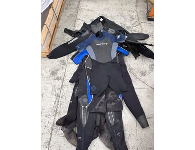 Collection of professional diving wetsuits and acc...