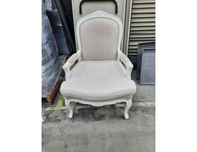 Armchair featuring a white finish timber style fra...