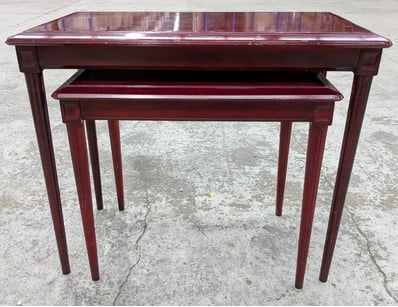 Elegant nesting tables set comprising two burgundy...