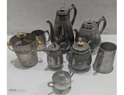 Assorted silverware includes items marked: "best S...
