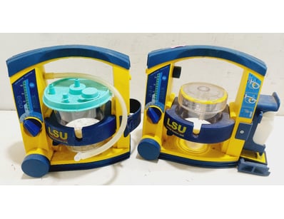 Laerdal Suction Unit (LSU) in a yellow and blue de...