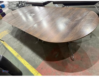 Contemporary conference table featuring a walnut-f...