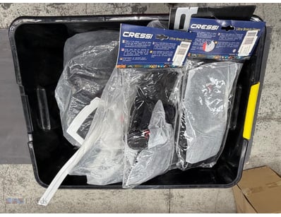 Assorted box of scuba diving equipment and tools. ...