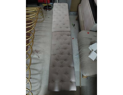 Elegant upholstered bench featuring button-tufted ...