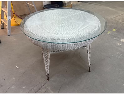 Elegant woven wicker round dining table featuring ...
