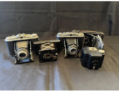 COLLECTION OF FIVE FOLDING CAMERAS

Item Size: H...