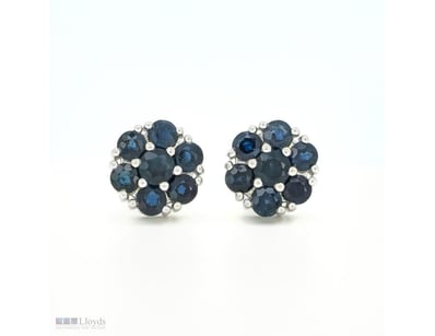 9CT WHITE GOLD CEYLON SAPPHIRE FLORAL STUD EARRING...