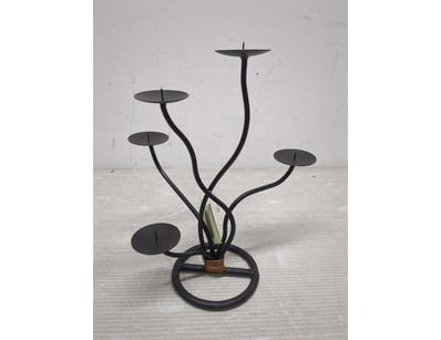 Elegant black metal candelabra featuring an organi...