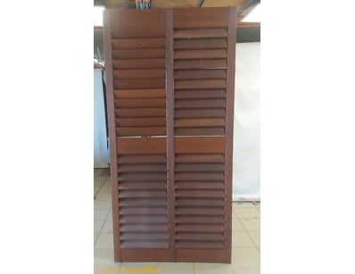 Wooden shutters featuring timber construction with...