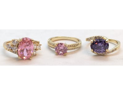THREE FAUX GOLD COLOURED STONE RINGS

Condition: G...