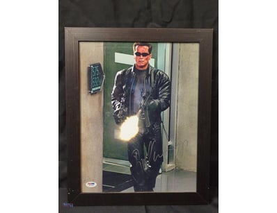THIS IMAGE FEATURES A FRAMED, SIGNED PHOTOGRAPH OF...
