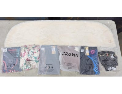 Bulk lot of clothing items in sealed plastic packa...