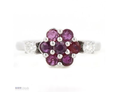 14K WHITE GOLD, RUBY AND DIAMOND, FLOWER RING.    ...