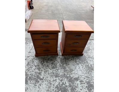 Pair of wooden bedside tables featuring three-draw...