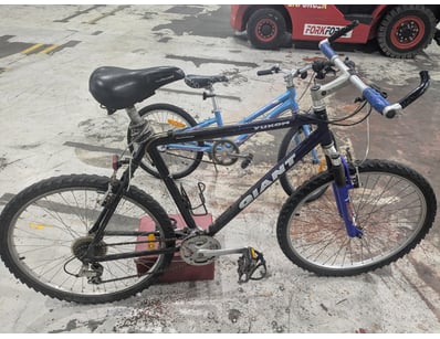 Yukon brand hybrid bicycle featuring a blue alumin...