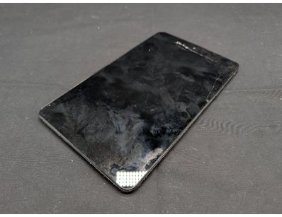 Dell tablet device in heavily used condition. The ...