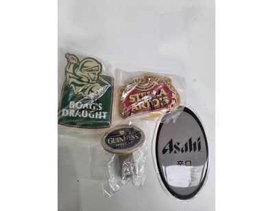 Collection of five vintage beer brand badges and p...
