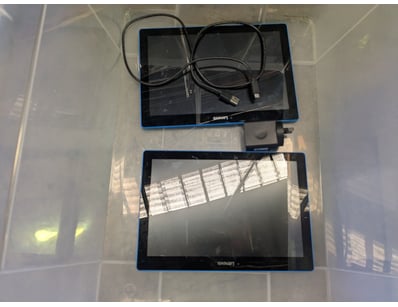 Lot comprising two blue-framed tablets with chargi...
