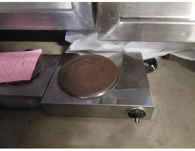 Single-burner electric crepe maker featuring a sta...