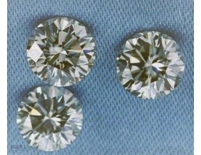 0.05 TCW LIGHT BROWN 3 ROUND DIAMOND         

Con...