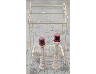 Cream-coloured metal shelving unit featuring three...
